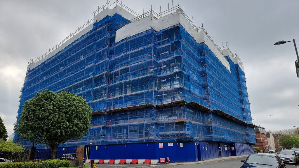 Scaffolding surrounding the Empress Heights building. Photo taken from the ground.