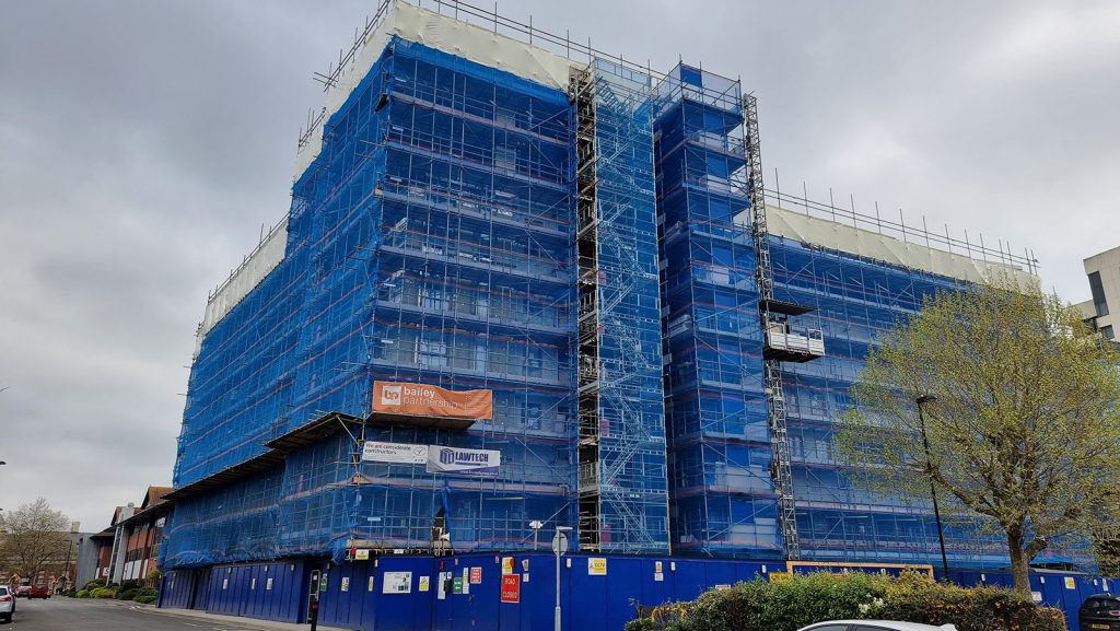 Scaffolding surrounding the Empress Heights building. Photo taken from the ground.